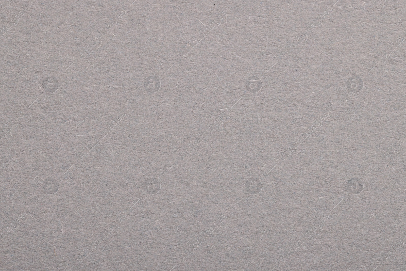 Photo of Texture of light grey paper sheet as background, top view