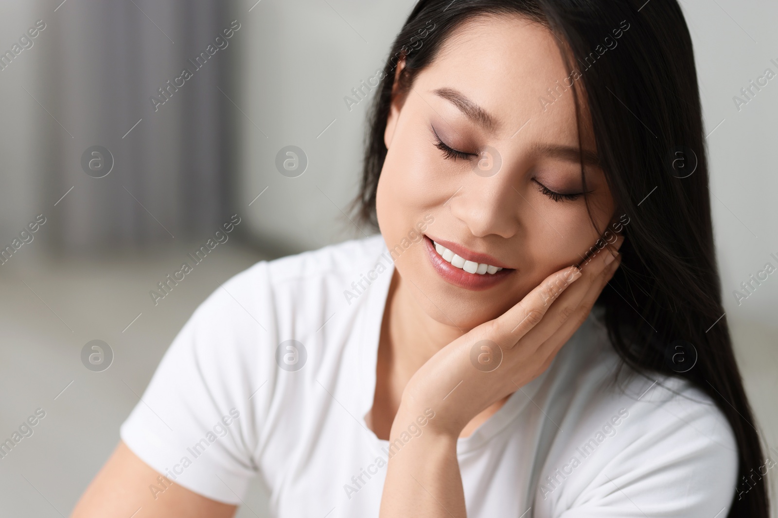 Photo of Portrait of beautiful woman with perfect skin at home