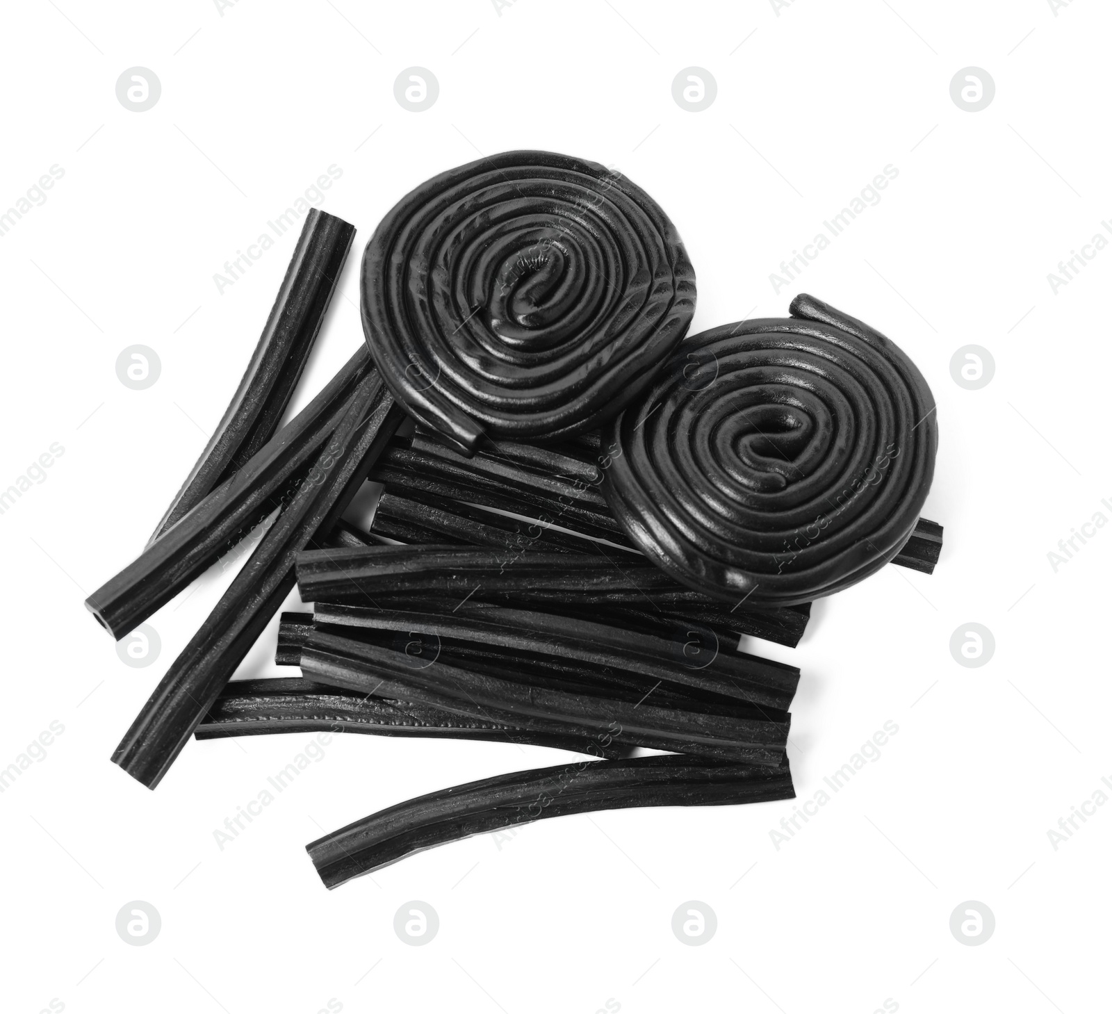 Photo of Tasty black liquorice candies on white background, top view