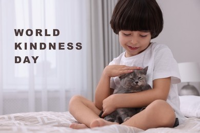 Image of World Kindness Day. Smiling boy stroking cat in bedroom