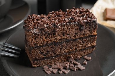 Photo of Delicious fresh chocolate cake on plate, closeup