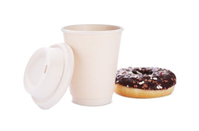 Photo of Tasty fresh donut with sprinkles and hot drink isolated on white