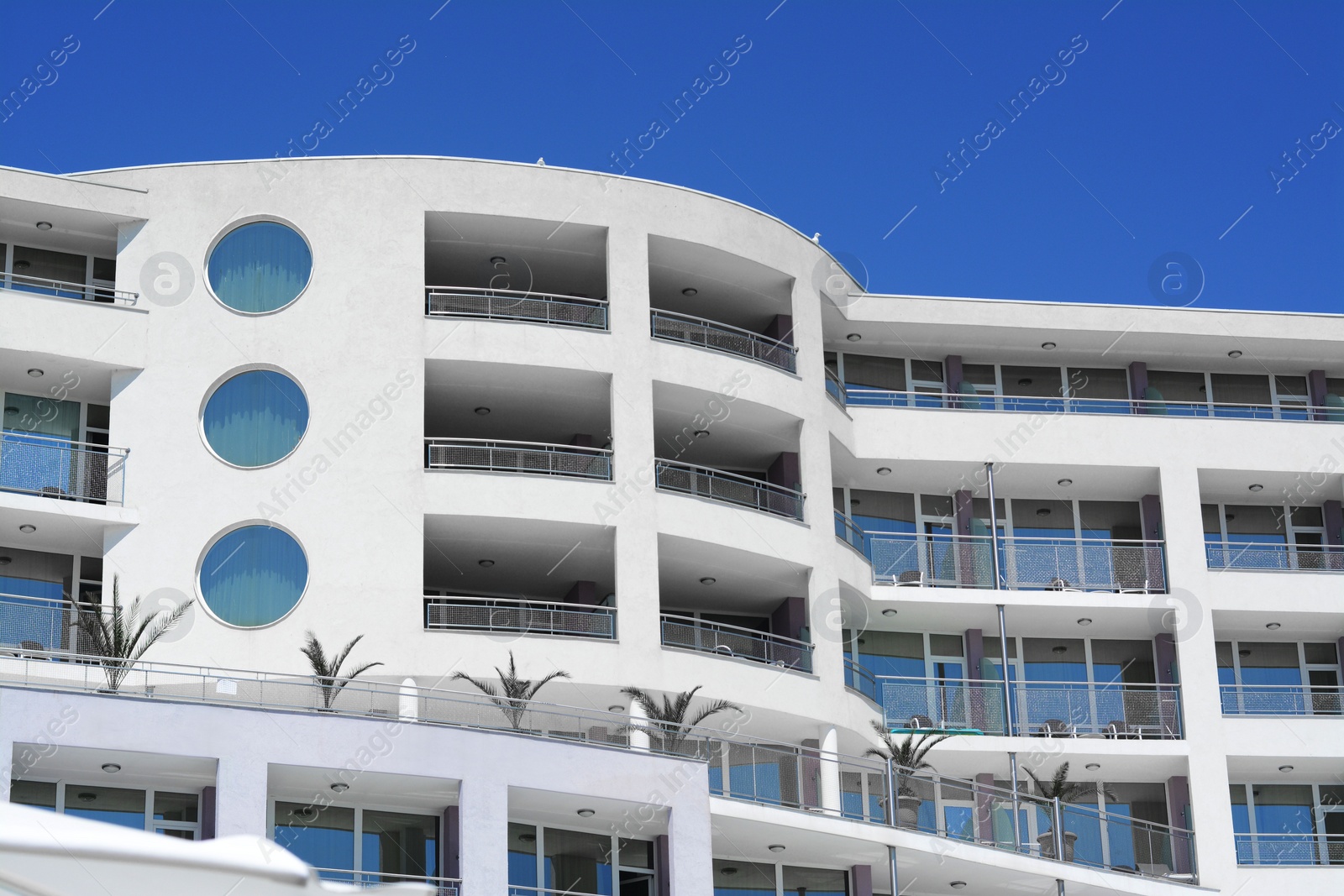 Photo of Exterior of beautiful residential building against blue sky