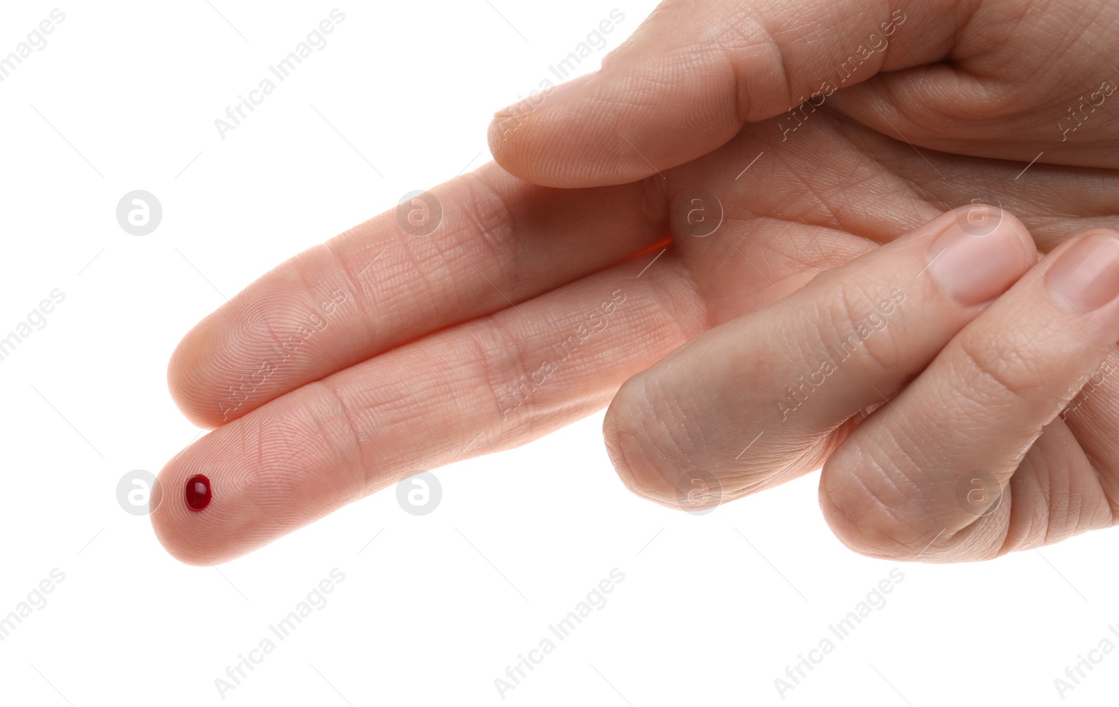 Photo of Woman with pricked finger and blood drop on white background, closeup