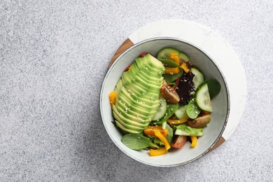 Photo of Healthy dish high in vegetable fats on light textured table, top view. Space for text