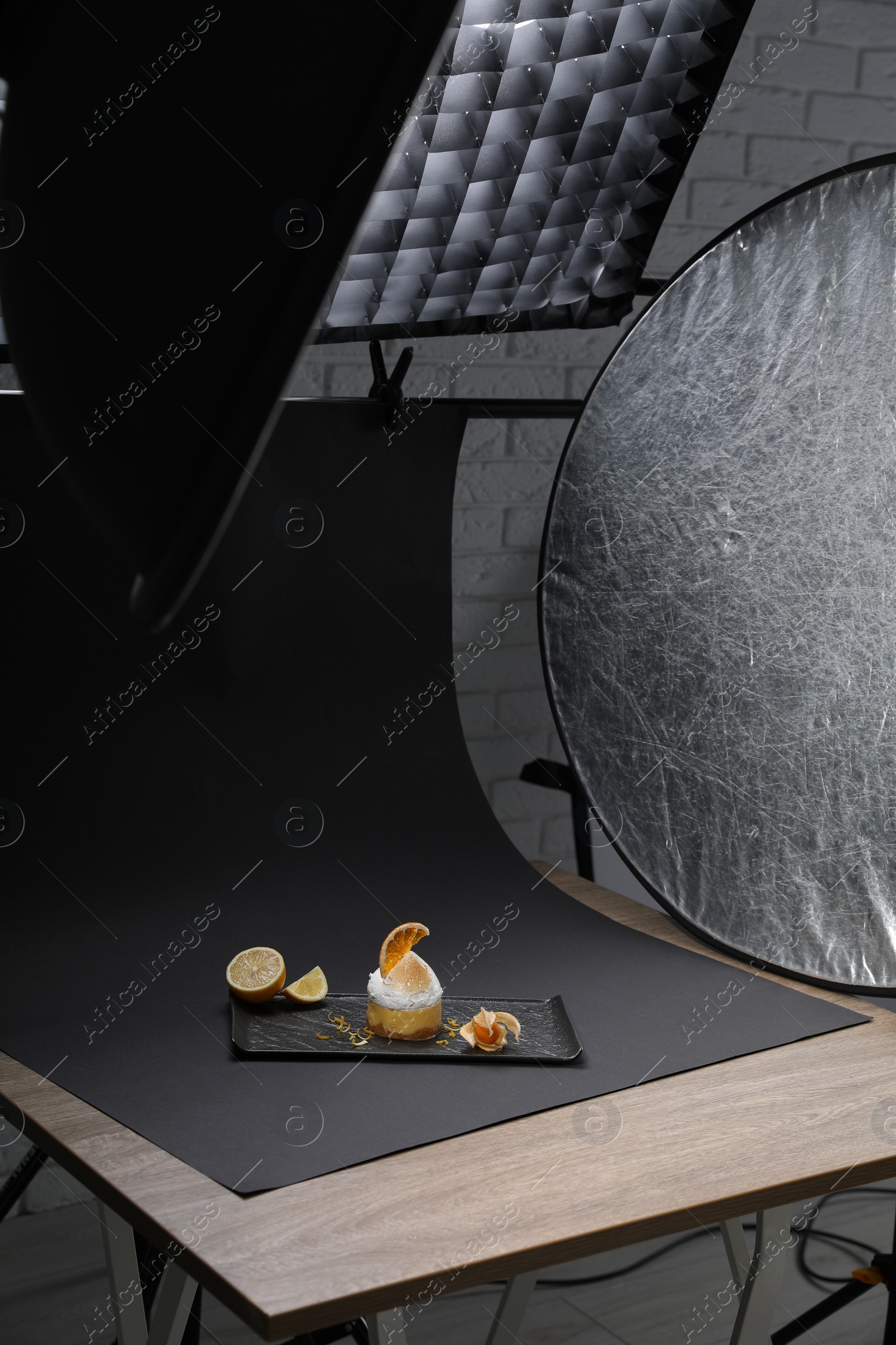 Photo of Beautiful composition with delicious dessert on black background in studio. Food photography