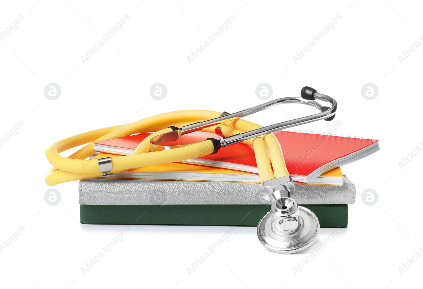 Photo of Stethoscope and notebooks on white background. Medical students stuff