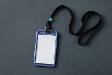 Photo of Blank badge with string on grey background, top view