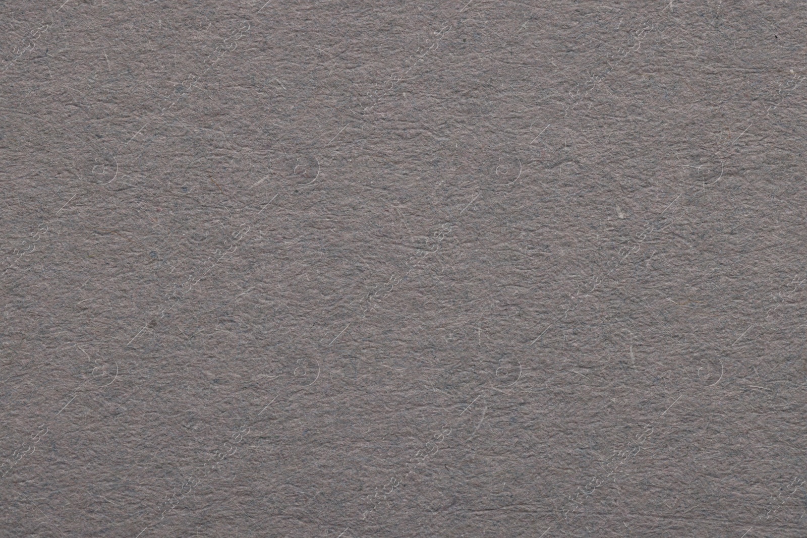 Photo of Texture of grey paper sheet as background, top view