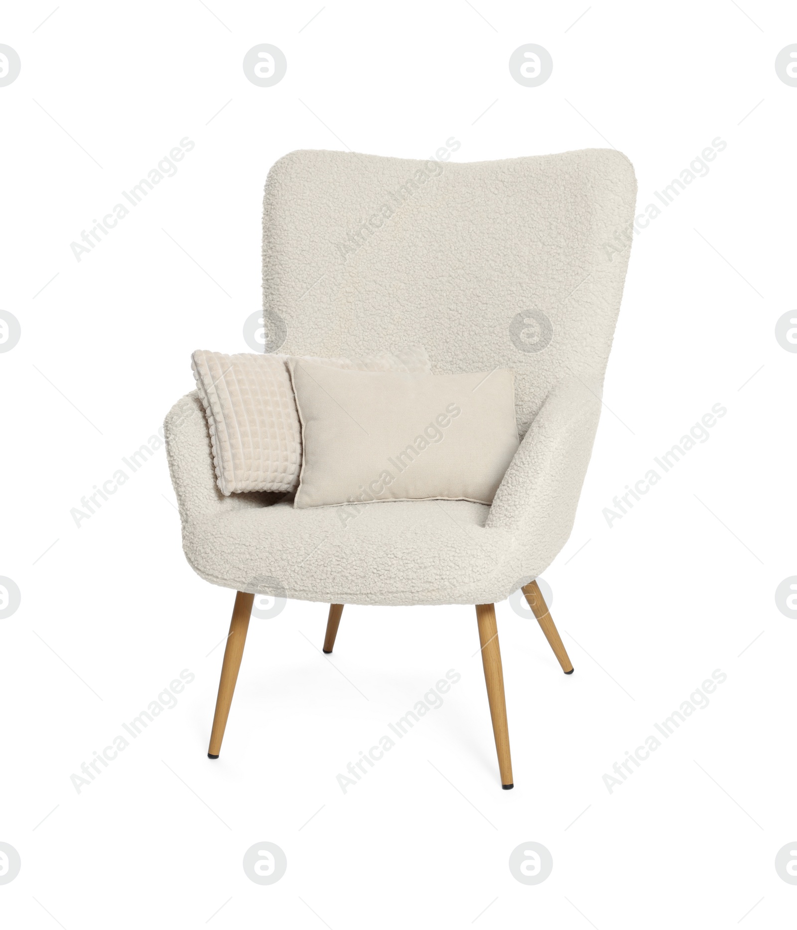 Photo of One stylish comfortable armchair with pillows isolated on white