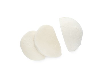 Delicious mozzarella cheese slices on white background, top view