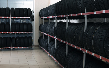 Car tires on rack in auto store