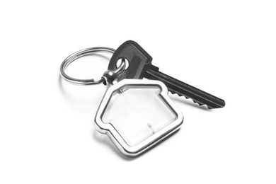 Photo of House key with trinket on white background