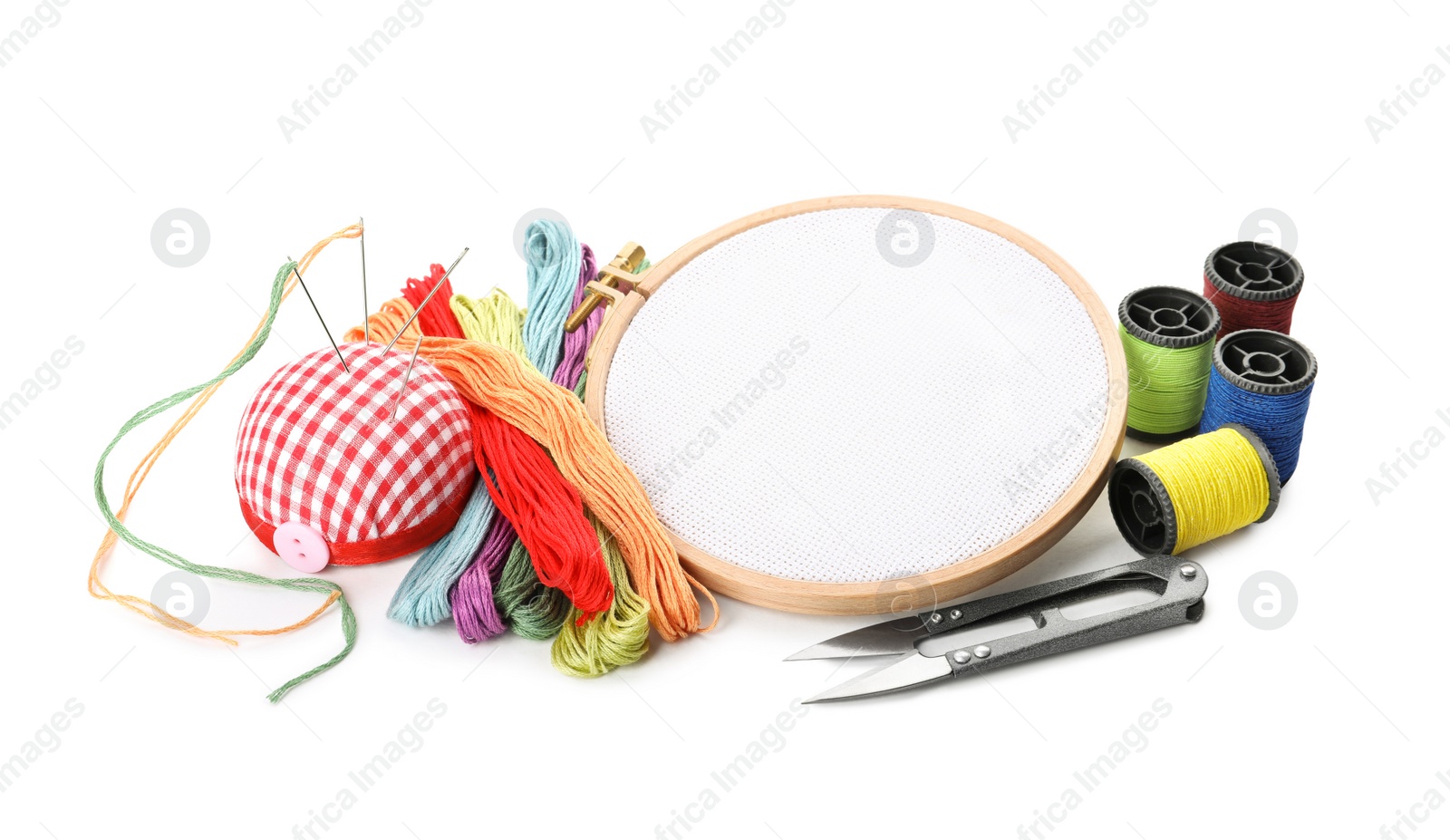 Photo of Set of embroidery equipment on white background