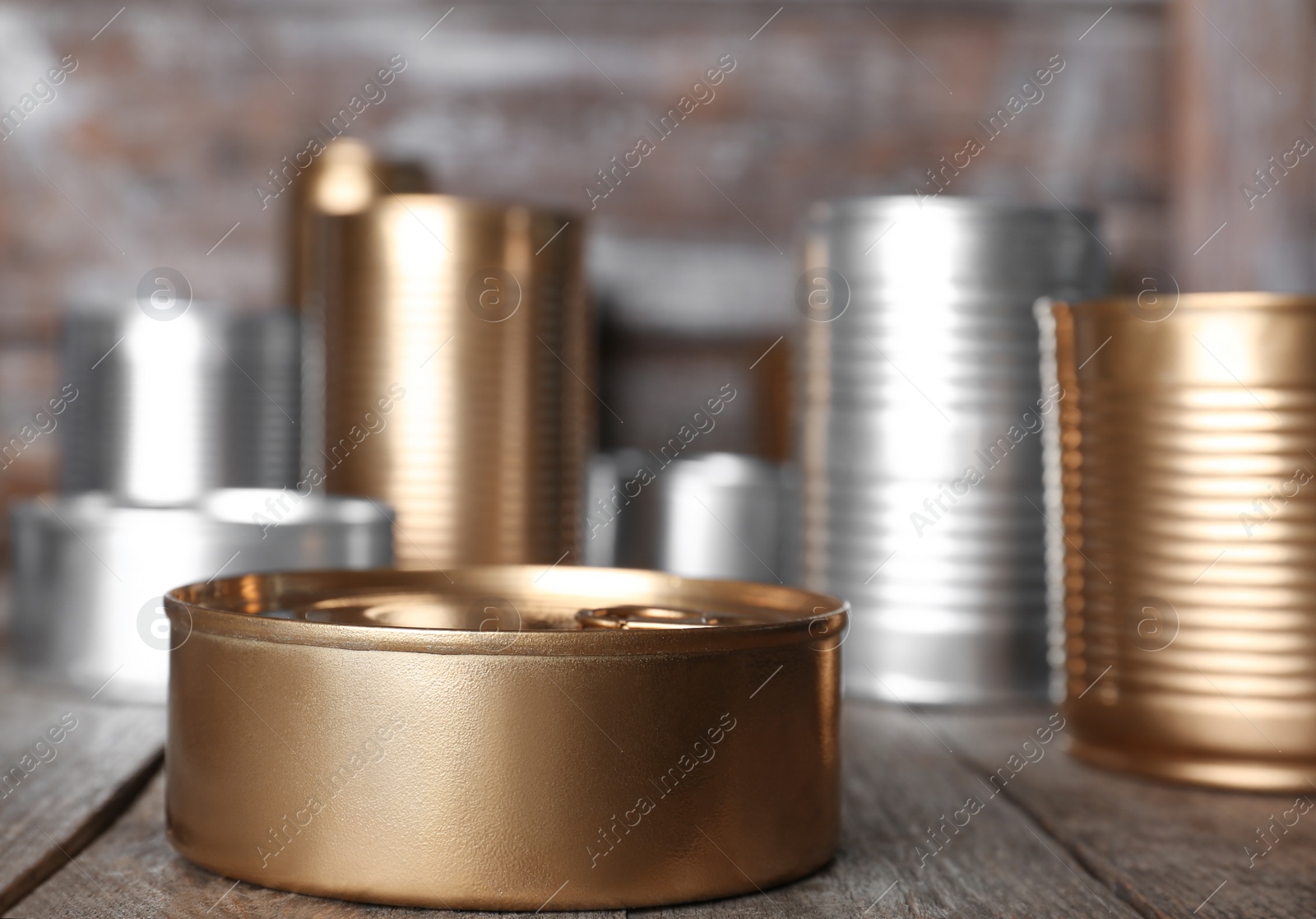 Photo of Many tin cans on table. Recycling garbage