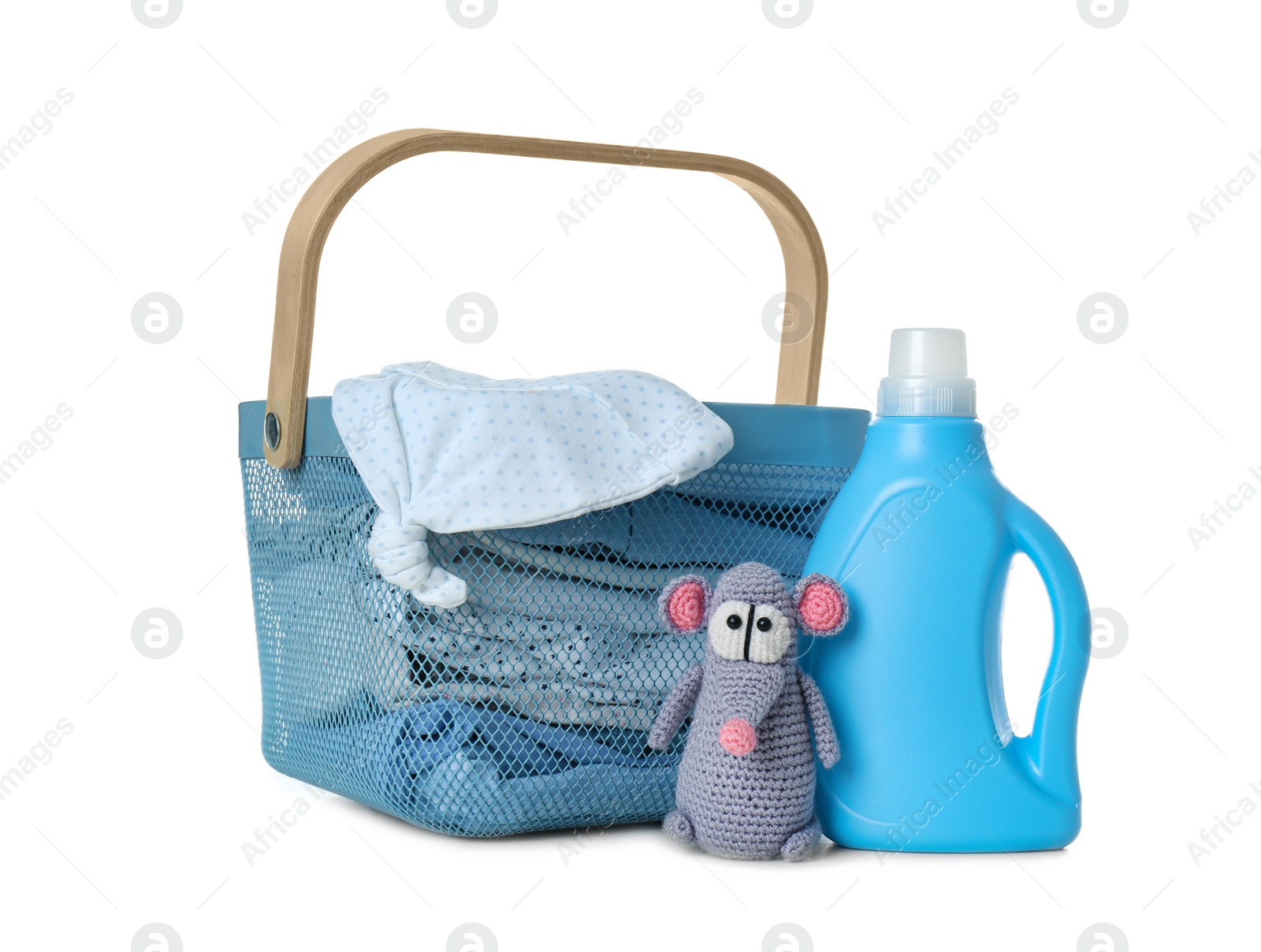 Photo of Basket with fresh baby laundry and bottle of detergent on white background