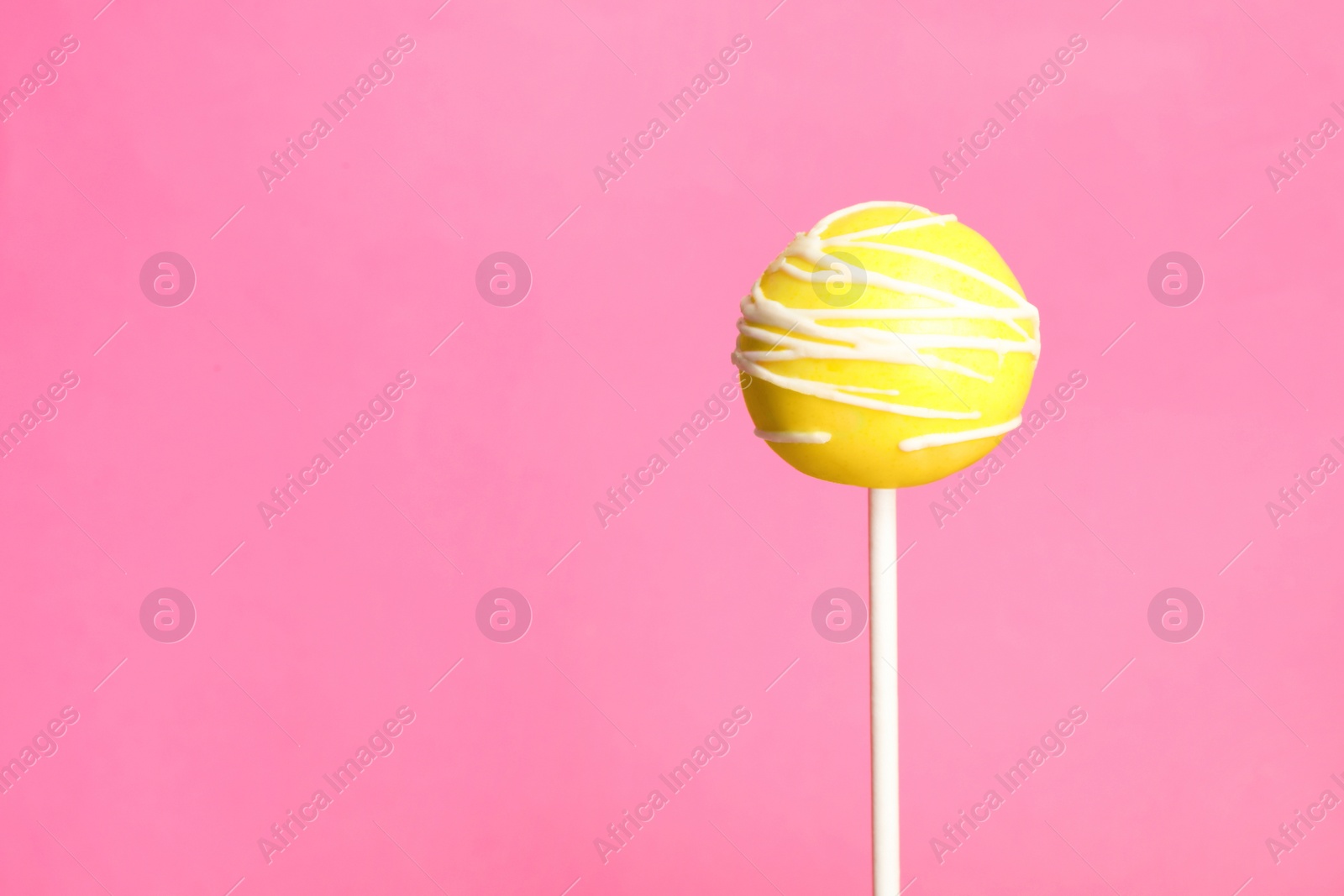 Photo of Bright delicious cake pop on color background. Space for text