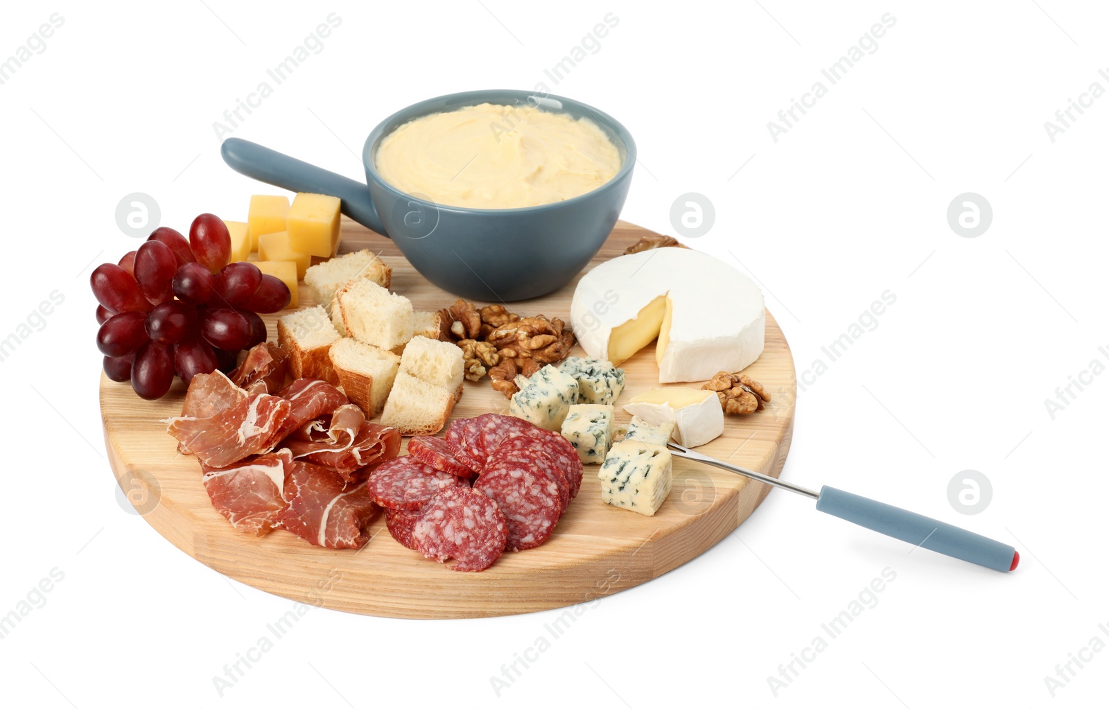 Photo of Fondue with tasty melted cheese, fork and different snacks isolated on white