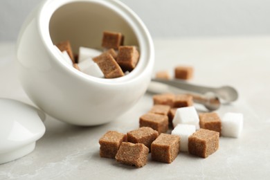 Bowl and refined sugar cubes on light table