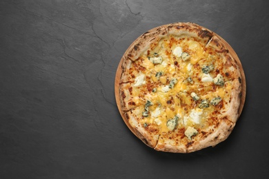 Image of Tasty cheese pizza on dark table, top view. Space for text