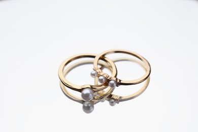 Elegant rings with pearls on mirror surface