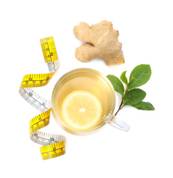 Diet herbal tea, measuring tape, ginger and leaves on white background, top view