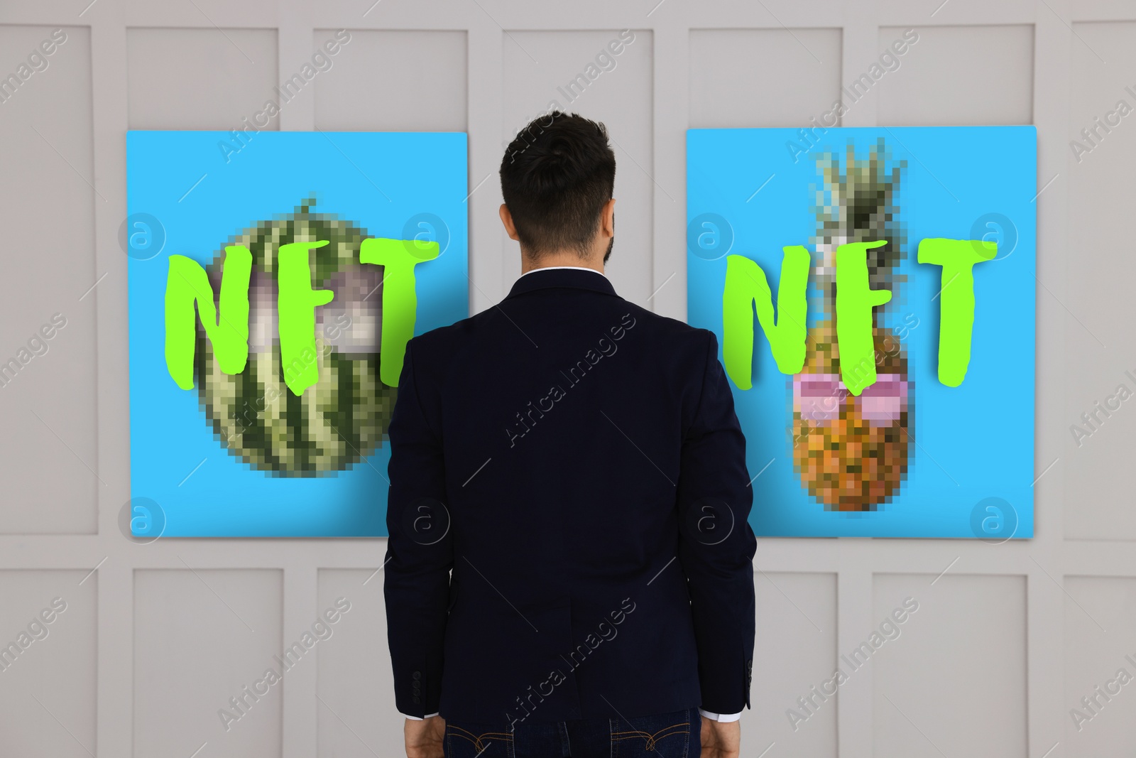 Image of Man near art images in gallery, back view. Pictures with abbreviations NFT