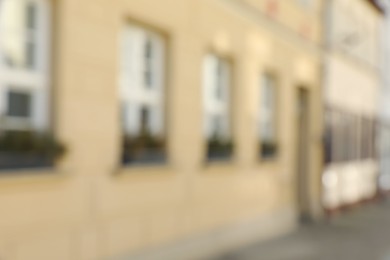 Photo of Blurred view of city street with beautiful building. Bokeh effect