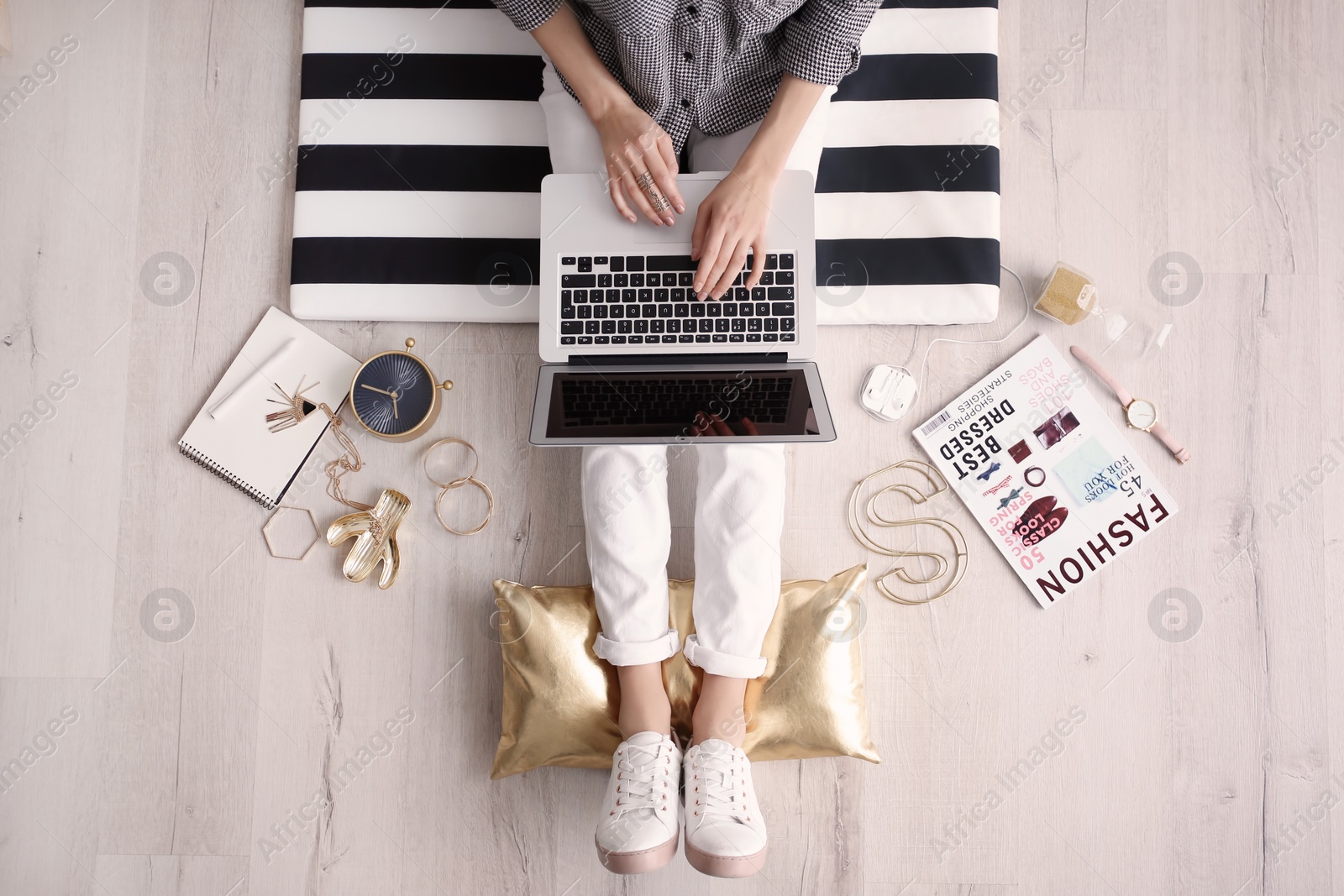 Photo of Female blogger with laptop indoors, top view