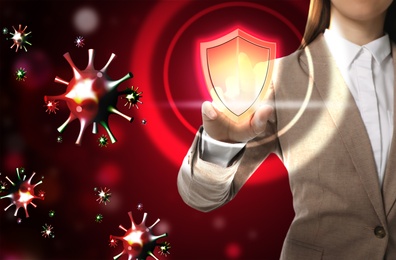 Image of Be healthy - boost your immunity. Woman activating shield icon as virus protection, closeup