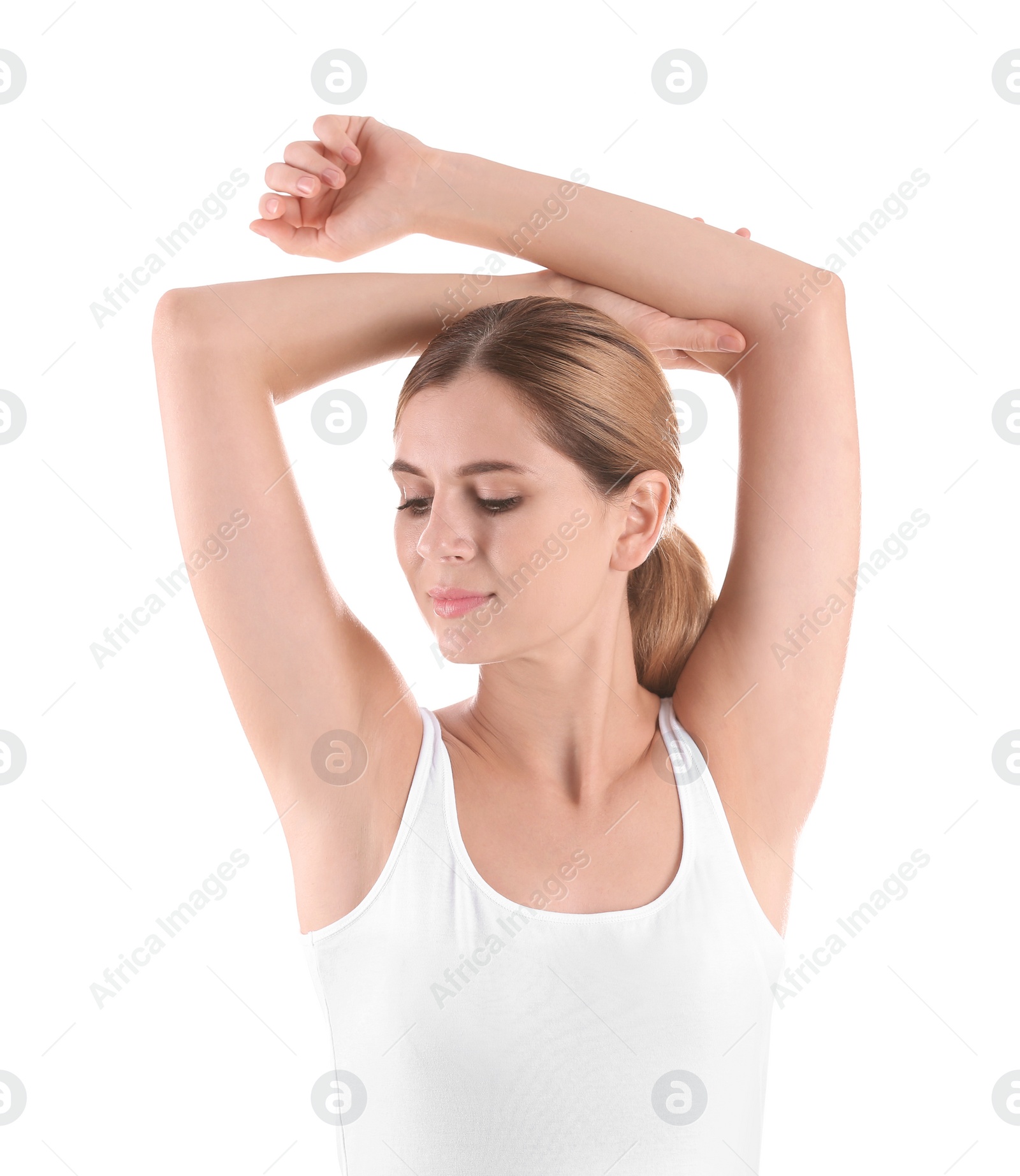 Photo of Young woman showing armpit on white background. Using deodorant