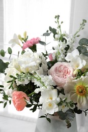 Photo of Bouquet of beautiful flowers on light background, closeup