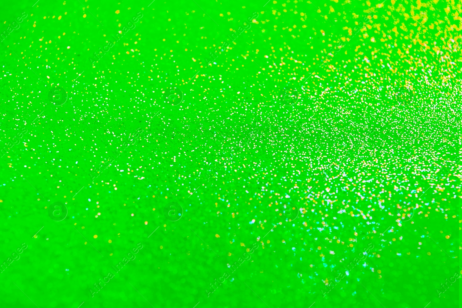 Image of St. Patrick day. Shiny green glitter, closeup. Bokeh effect