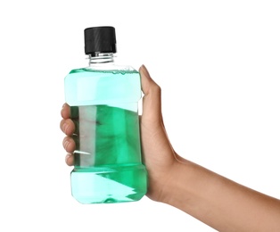 Photo of Woman holding bottle with mouthwash for teeth care on white background