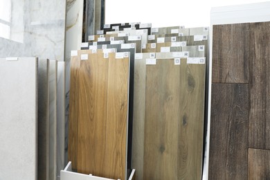 Photo of Assortment of tiles in store. Many different samples indoors