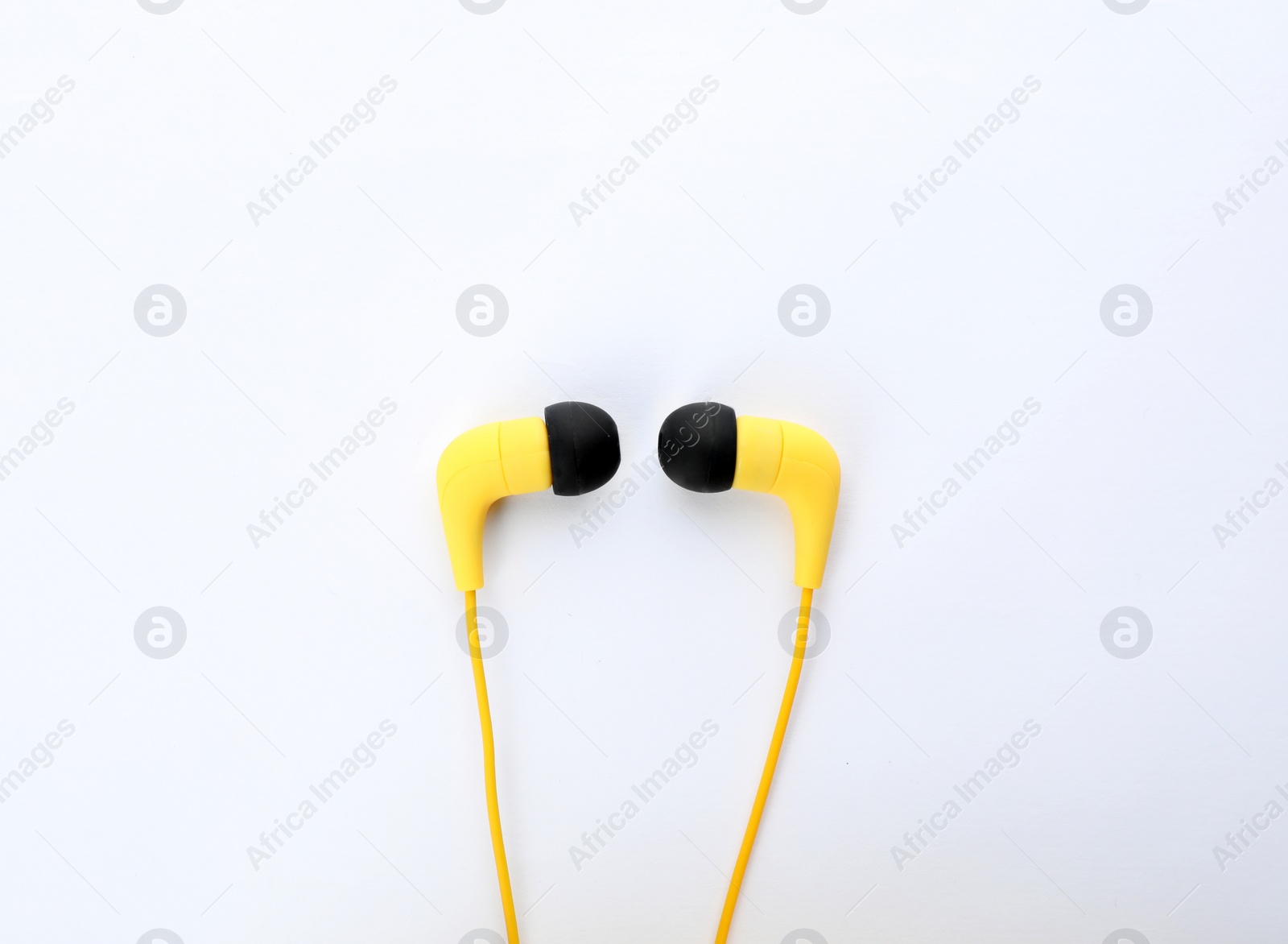 Photo of Stylish modern headphones on white background, top view