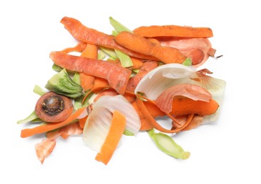 Photo of Peels of fresh vegetables isolated on white, above view
