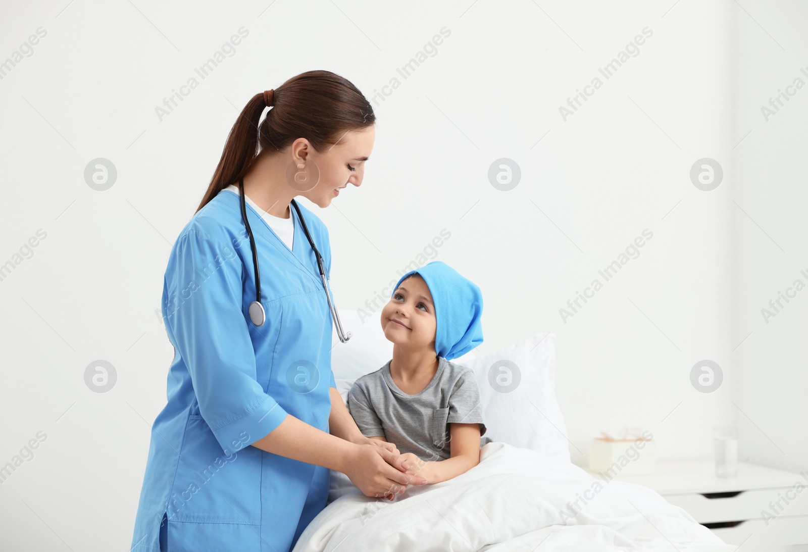 Photo of Childhood cancer. Doctor and little patient in hospital