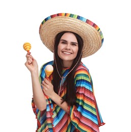 Photo of Young woman in Mexican sombrero hat and poncho with maracas on white background