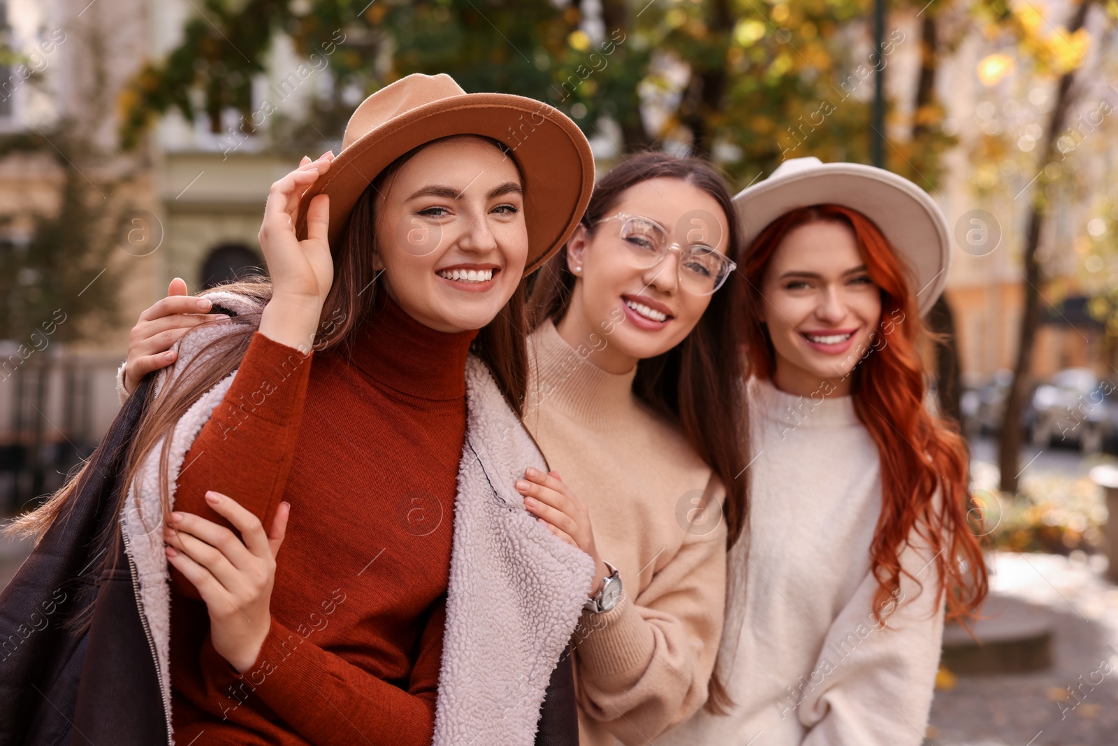 Photo of Portrait of happy friends spending time together outdoors