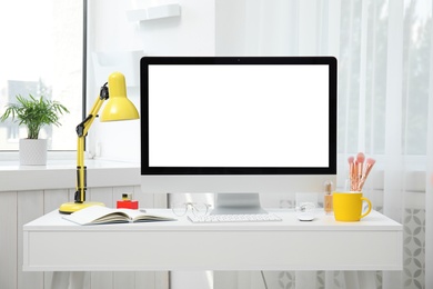 Comfortable workplace with modern computer on table