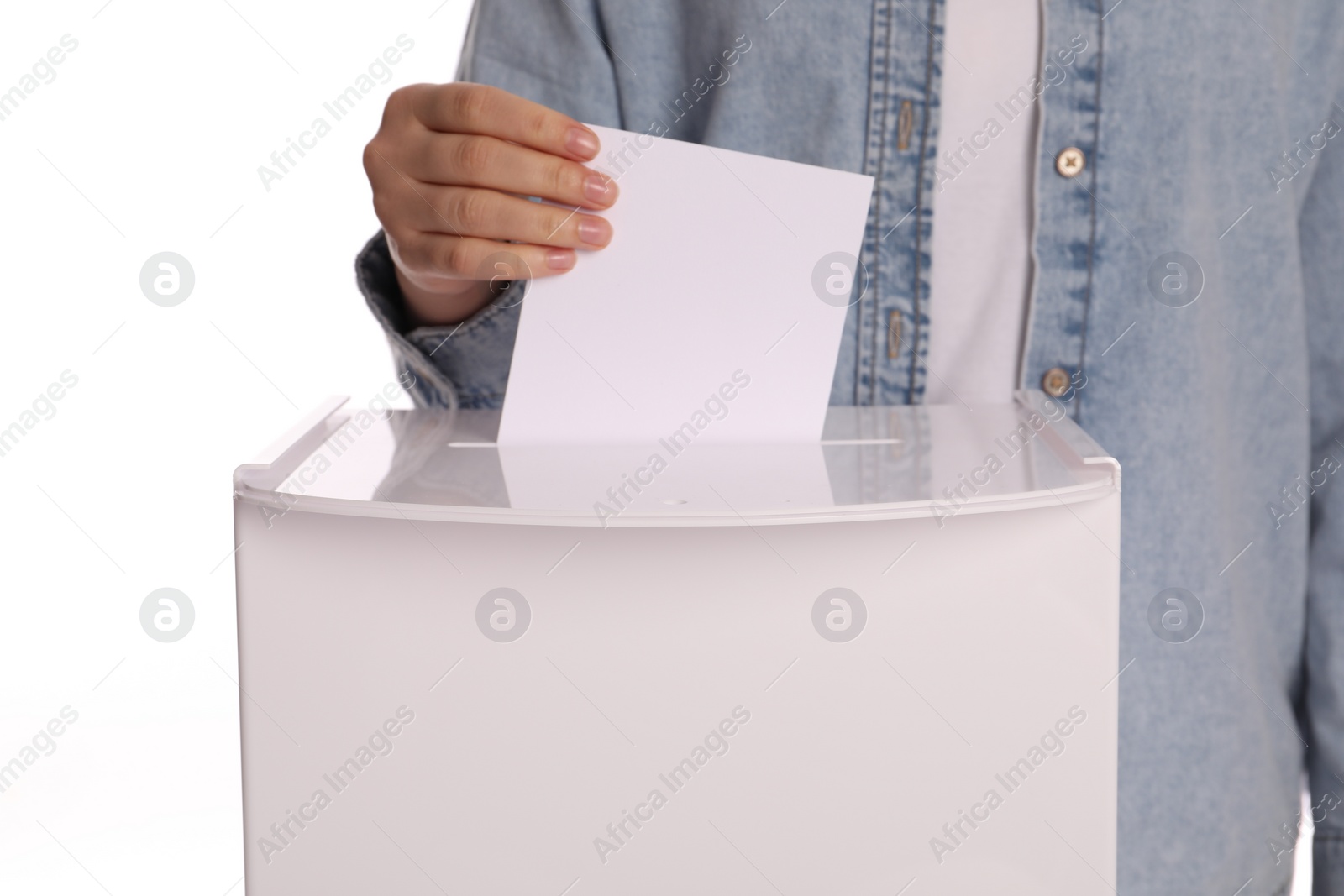 Photo of Woman putting her vote into ballot box on white background, closeup