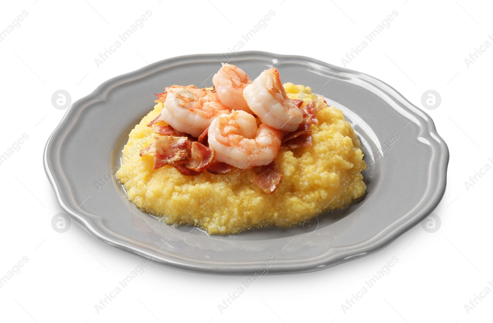 Photo of Plate with fresh tasty shrimps, bacon and grits isolated on white