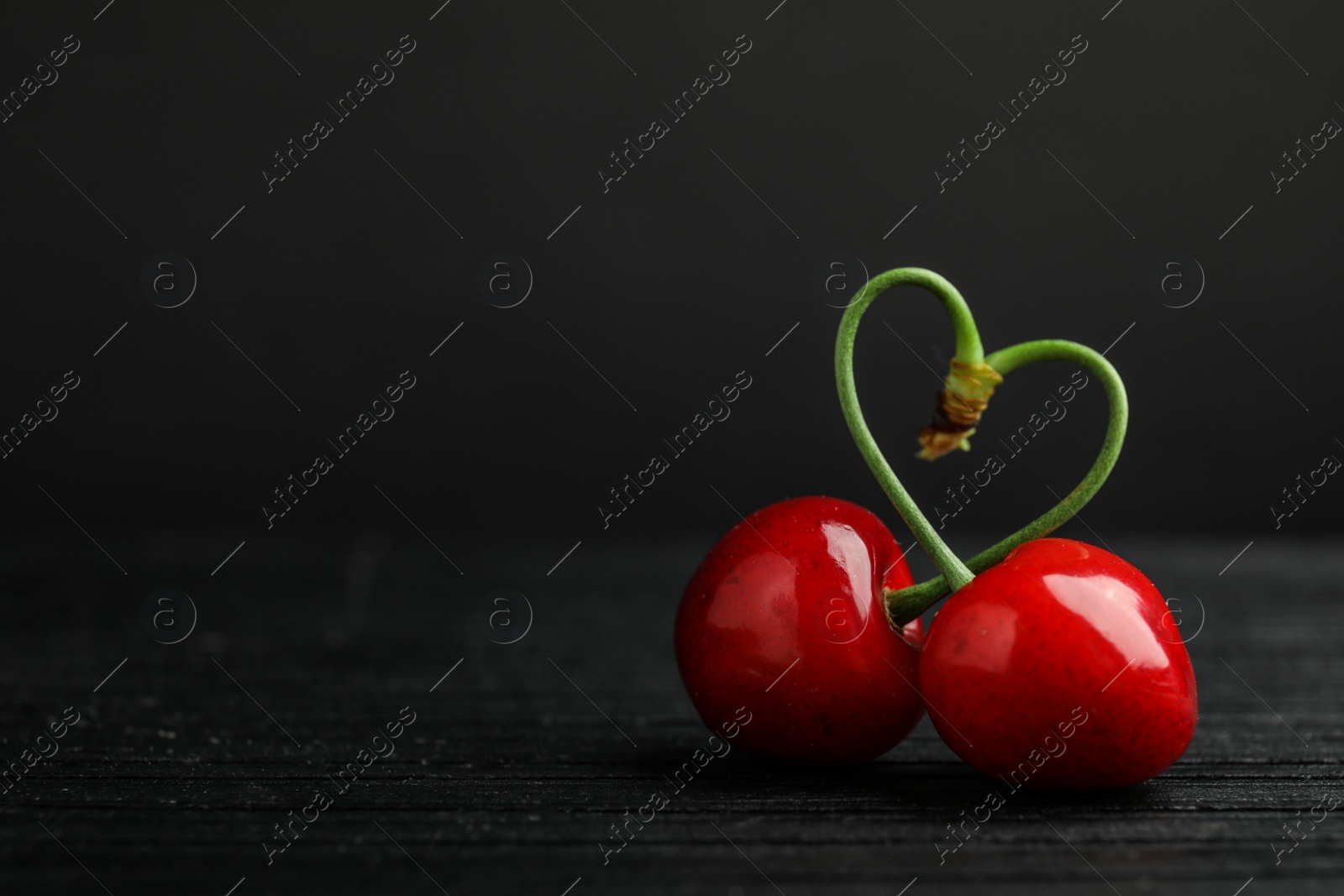 Photo of Sweet red cherries on table