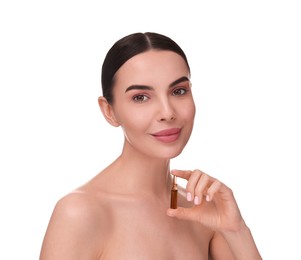 Beautiful young woman holding skincare ampoule on white background