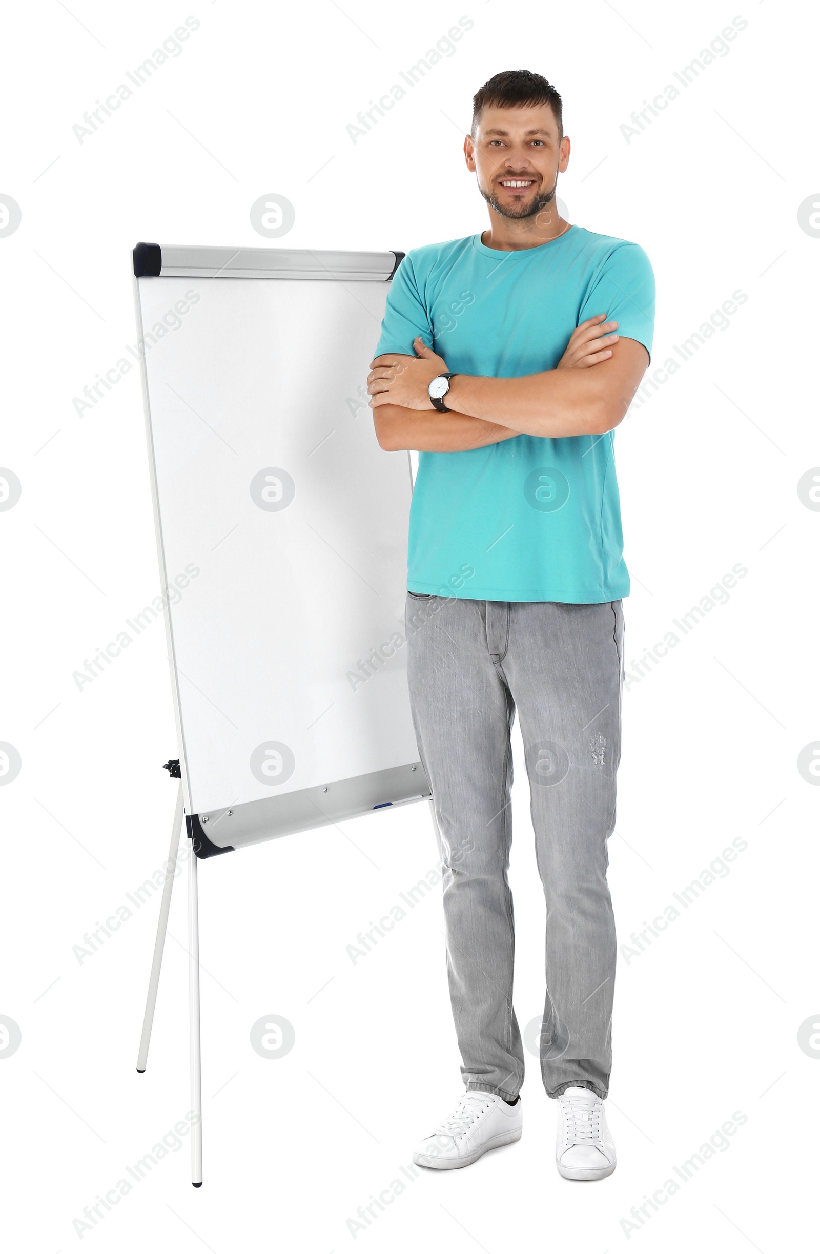 Photo of Professional business trainer near flip chart board on white background