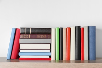 Photo of Bunch of different books on wooden table