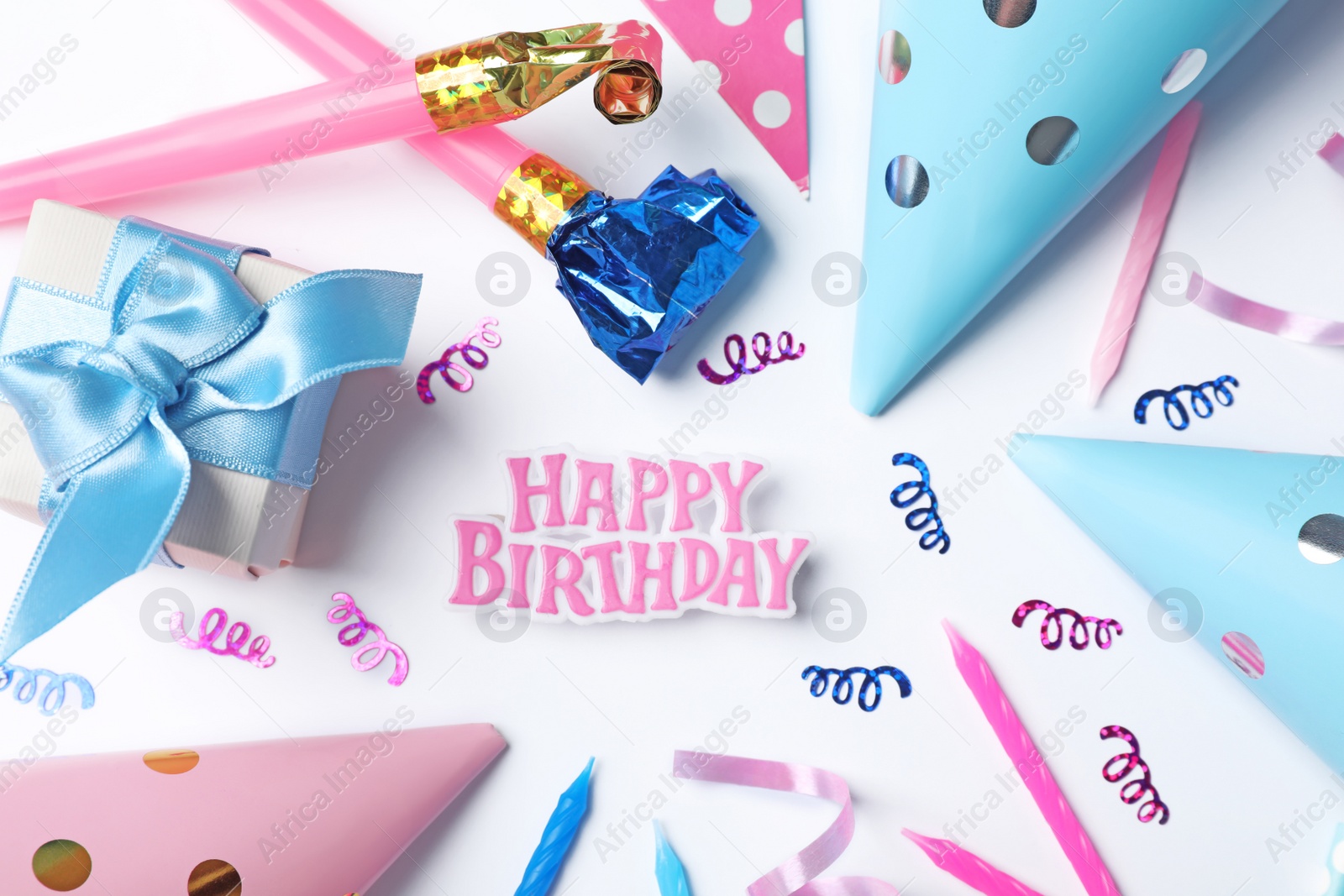 Photo of Flat lay composition with birthday party items on light background