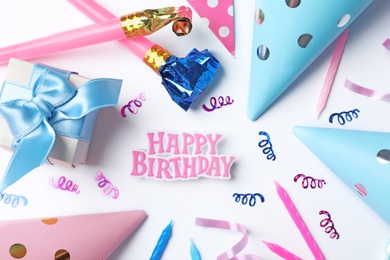 Flat lay composition with birthday party items on light background