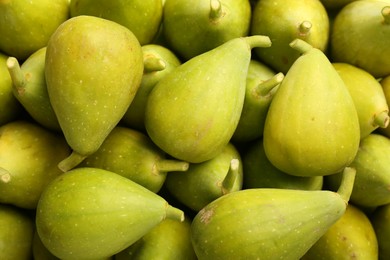 Photo of Many fresh green figs as background, top view